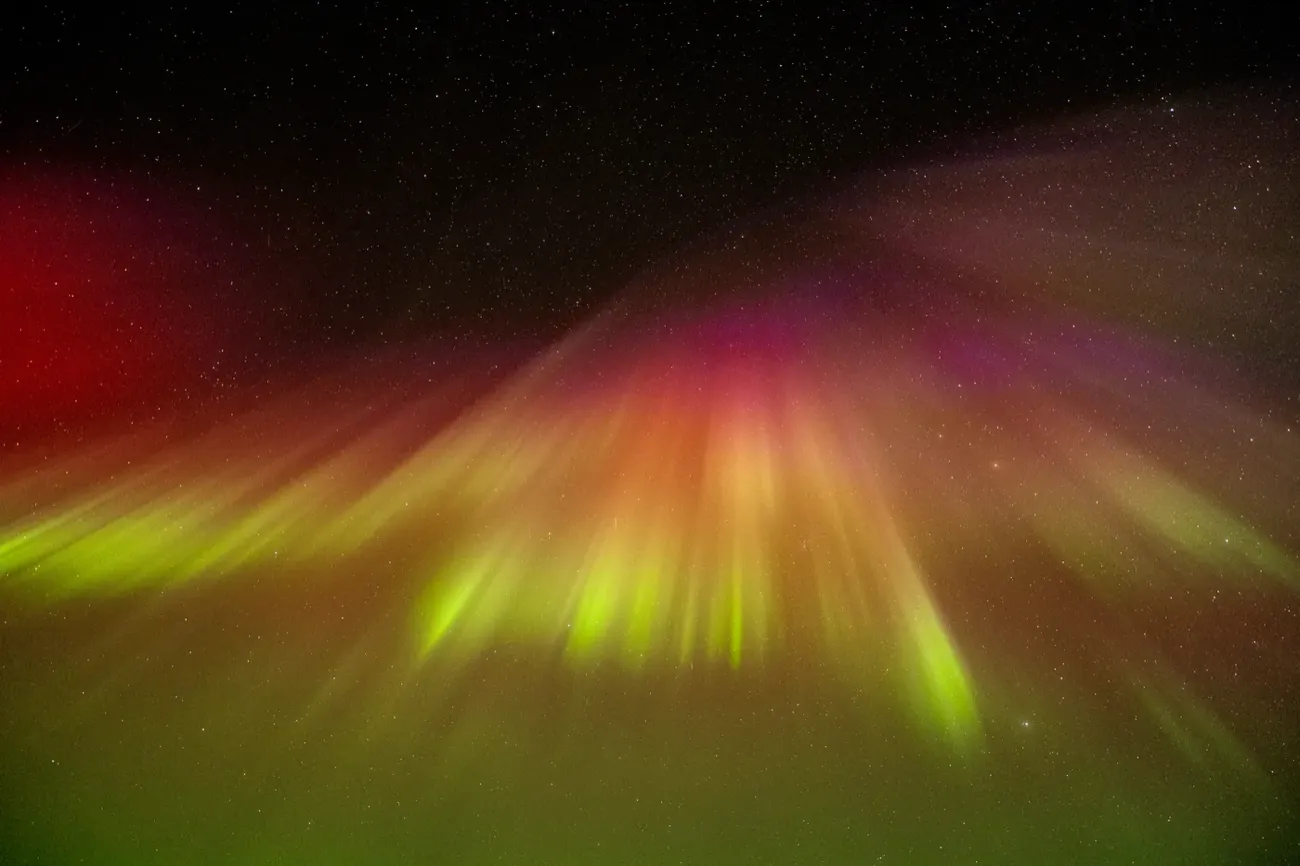 Rare red and yellow aurora corona photographed on an Experience Tours hunt